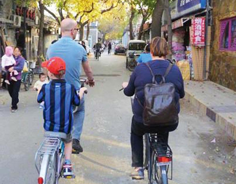 Bike trough ancient Beijings city streets.
